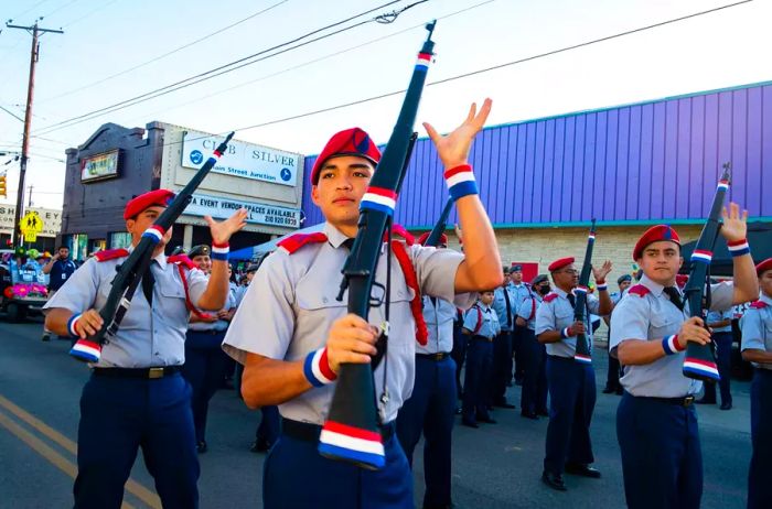 Young ROTC cadets kick off the Vanguard segment of the parade.