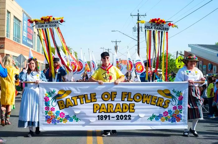 The Belgian American Club of Texas proudly leads the Battle of Flowers Parade.