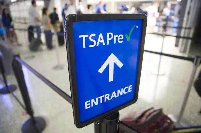 A TSA PreCheck sign is prominently displayed at Dulles International Airport in Dulles, Virginia.