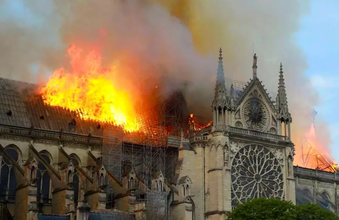 Smoke and flames rise from the roof of Notre-Dame Cathedral on April 15, 2019, in Paris, France.