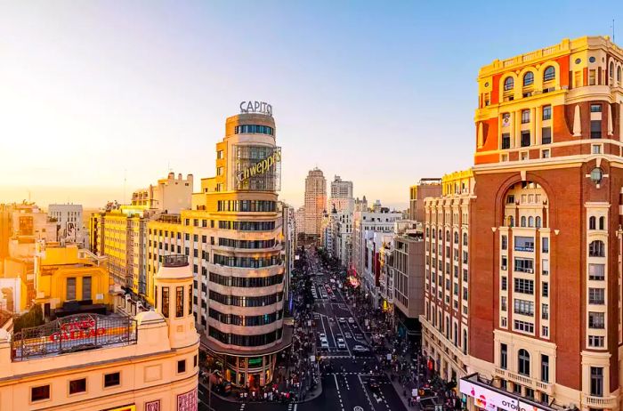 Aerial view of Madrid's cityscape featuring Gran Via street at sunset, Spain