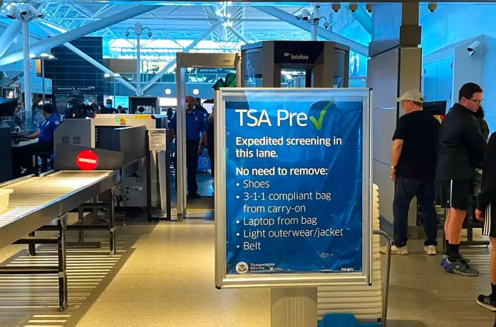 Travelers passing through the TSA PreCheck security line at JFK airport.