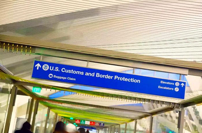 Close-up view of Customs and Baggage Claim sign.