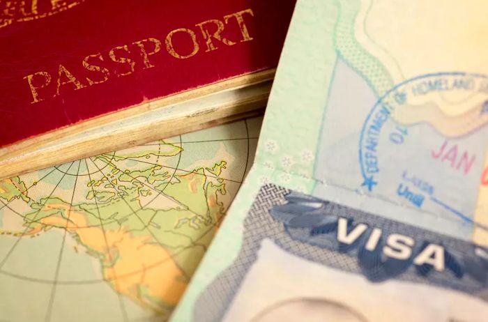 Close-up view of passport edges with a map in the background