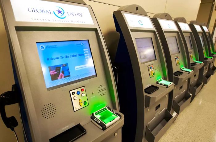 A row of Global Entry kiosks located at Dulles International Airport.