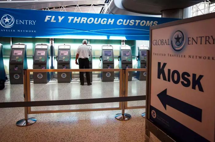 A traveler utilizes the Global Entry kiosk at the Federal Inspection Services customs facility at Bush Intercontinental Airport.