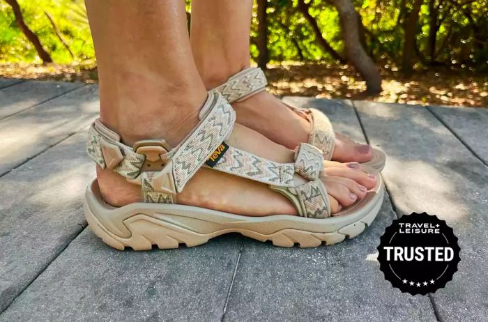 Closeup shot of someone wearing Teva Terra Fi 5 Universal Sandals outdoors