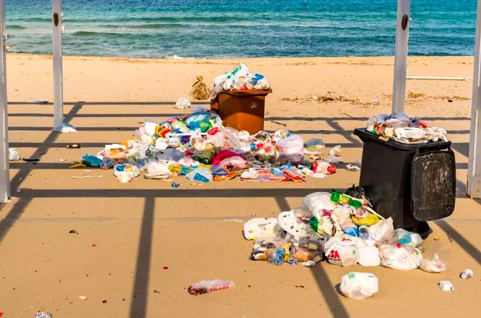 Containers littering the sand at Isola delle Femmine in Sicily.