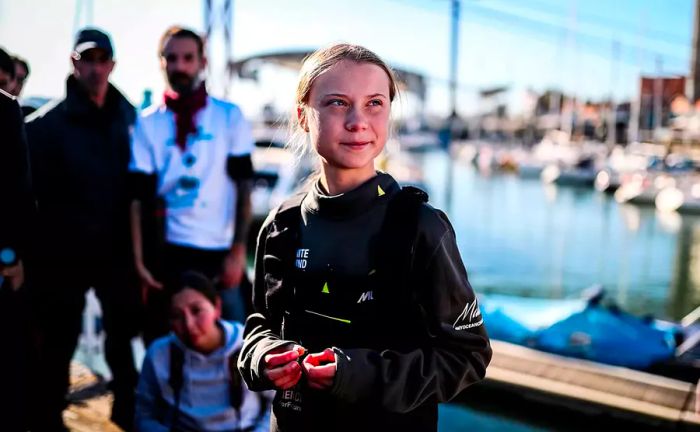 Swedish climate activist Greta Thunberg is seen after arriving at the Santo Amaro docks in Lisbon aboard the catamaran La Vagabonde.