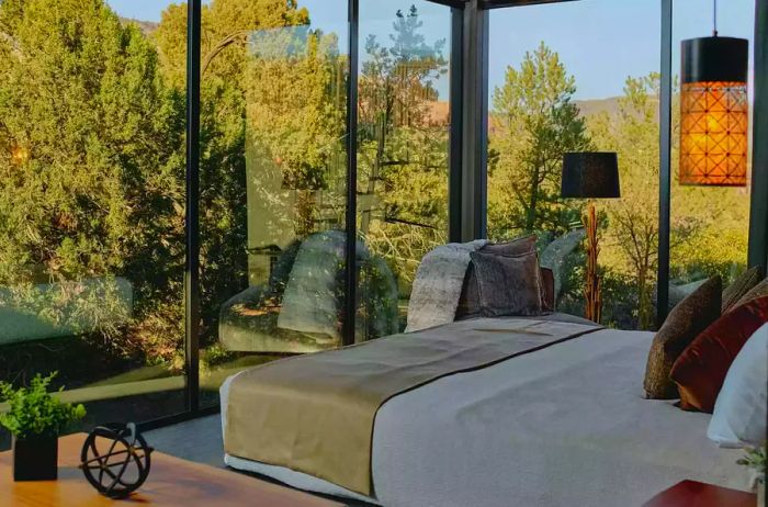 A glass-walled guest room at Ambiente Landscape Hotel in Sedona, Arizona.