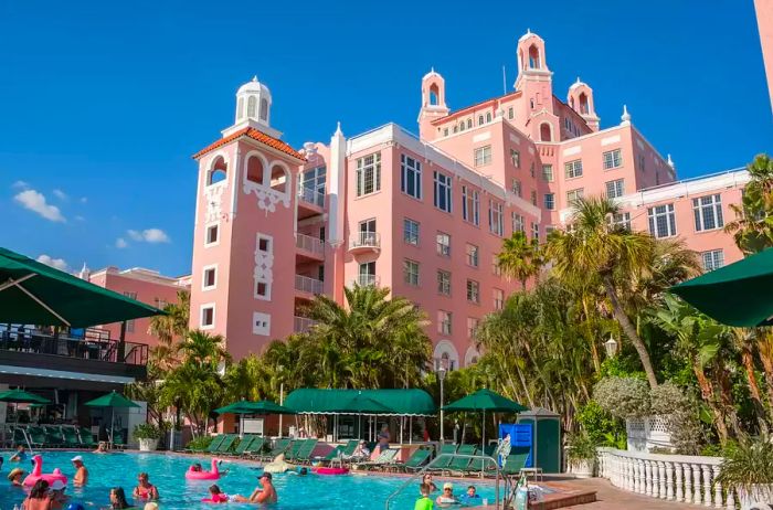 Guests enjoying the pool at the Don CeSar Hotel