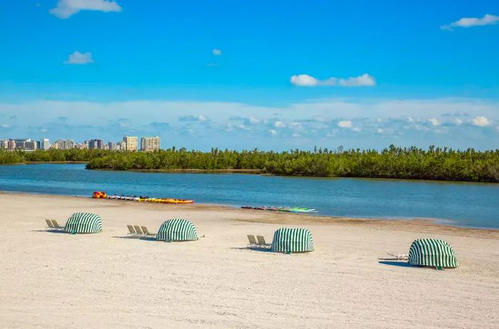 The pristine sandy shores of Marco Island, framed by hotels in the background