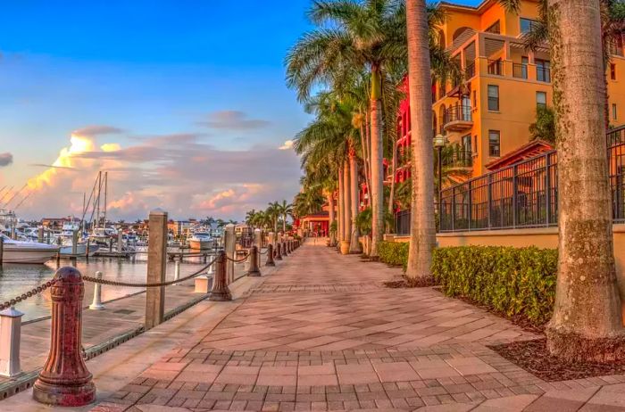 A stunning sunset over the boats at Esplanade Harbor Marina in Marco Island, Florida