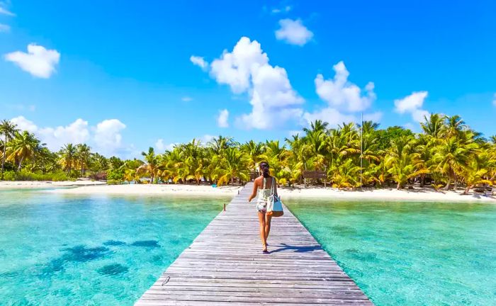 Tourists strolling along the jetty at Tikehau Atoll, Tuamotu Archipelago, French Polynesia, Oceania Tips for Instagram Captions