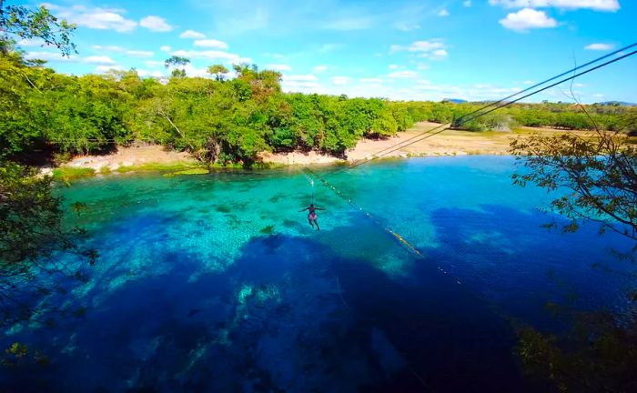 Adventurer enjoying ziplining at Gruta da Pratinha, Chapada Diamantina National Park, Bahia, Brazil – Instagram Caption Tips