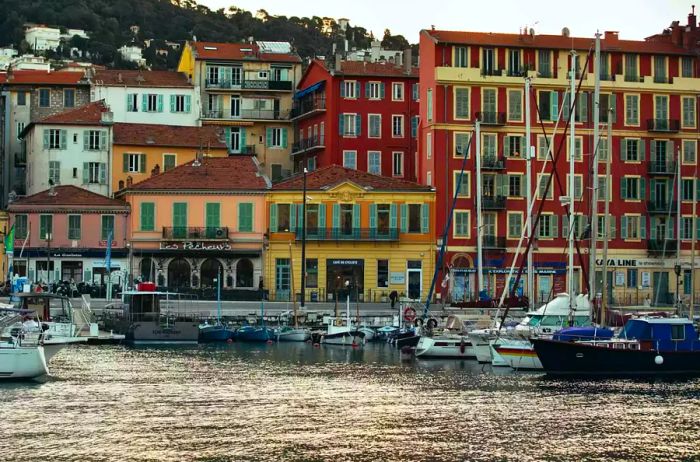 The picturesque port of Nice framed by vibrant buildings in the background.