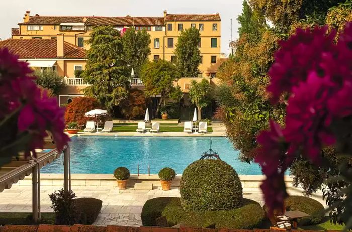 Lush greenery encircling the pool at the Cipriani Hotel in Venice, Italy