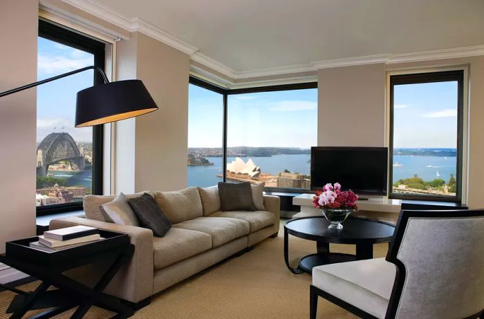 A living room in a guest room at the Four Seasons Hotel Sydney