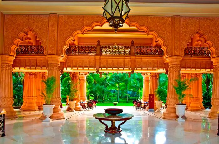 A spacious double-height lobby area at The Leela Palace Bengaluru hotel