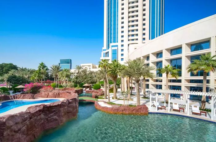 The stunning exterior and swimming pools of The Ritz-Carlton, Doha