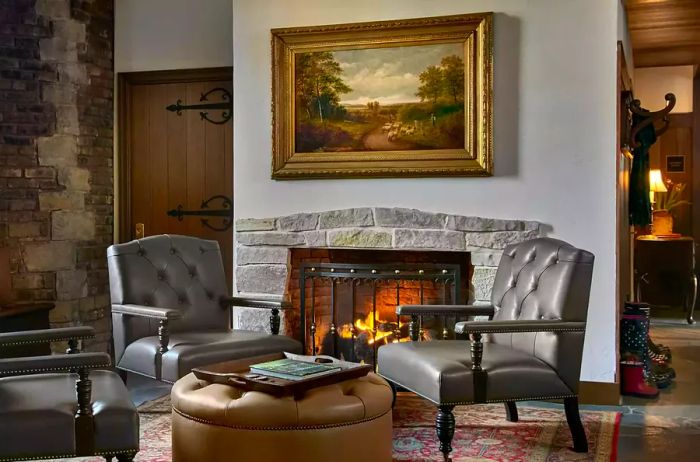 Cozy seating by the fireplace at Deer Path Inn