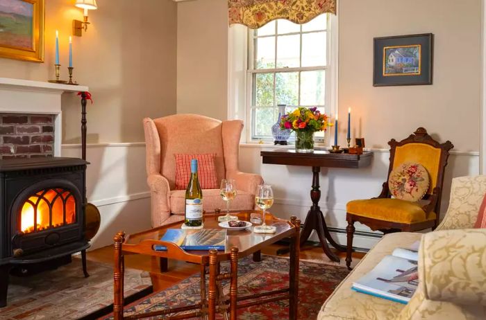 Candleberry Inn's cozy living room with a fireplace