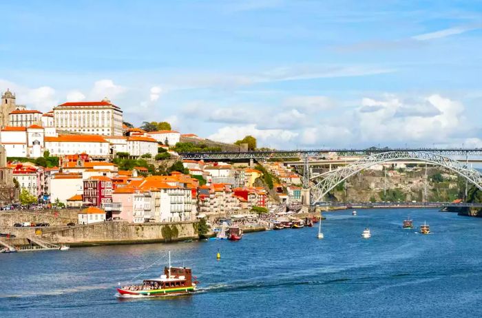 Boats sailing on the river in Porto, Portugal