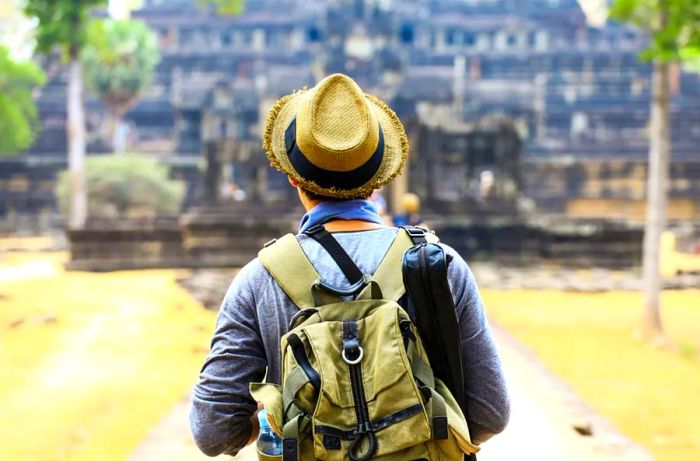 a visitor at Angkor Wat temple