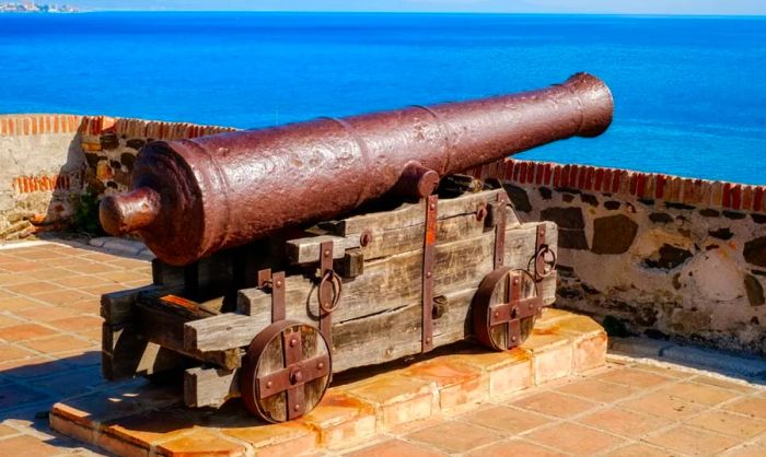 An old wartime cannon overlooking a vast, open sea