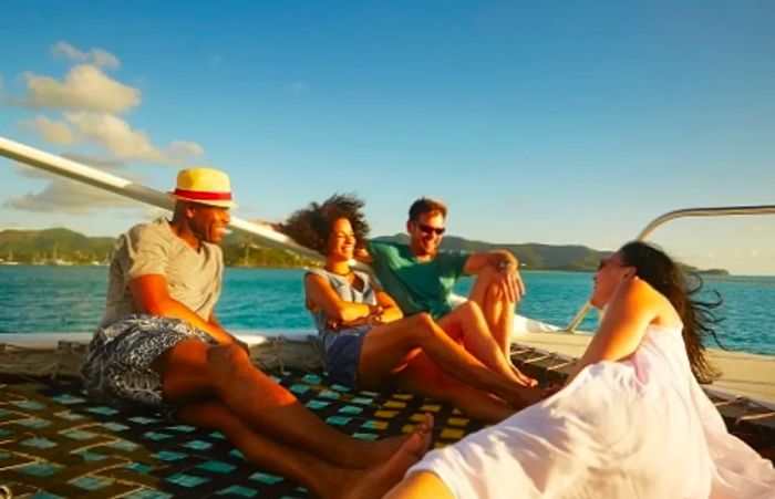 a group of friends enjoying a luxury catamaran in the Caribbean