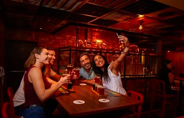 a group of friends posing for a photo at a table