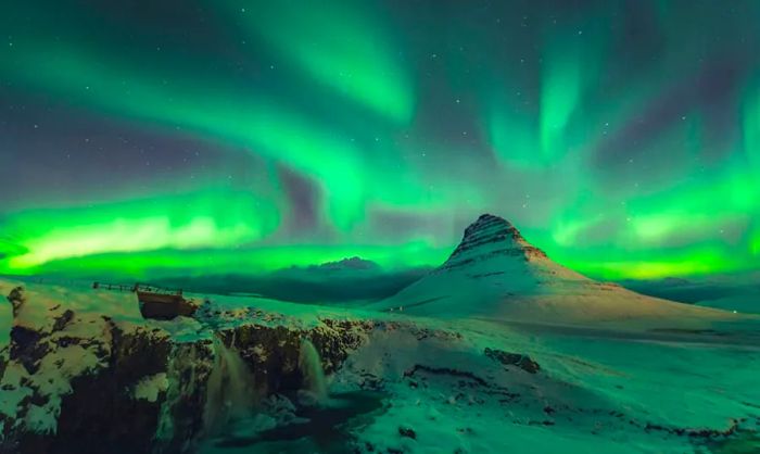 Northern Lights illuminating a snowy wilderness.