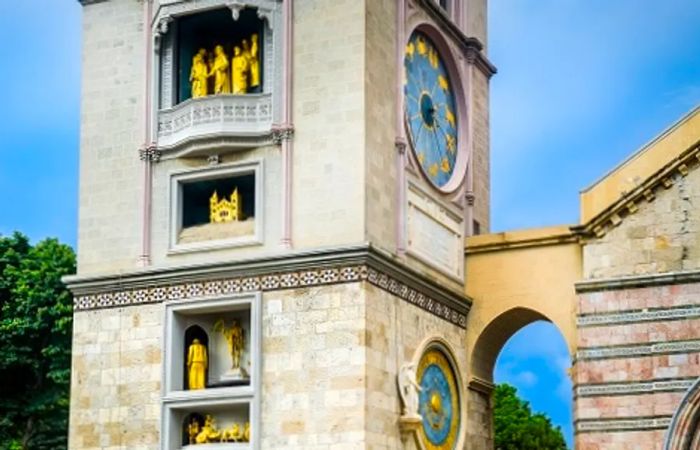 the statues on the astronomical clock tower of the Cathedral of Messina