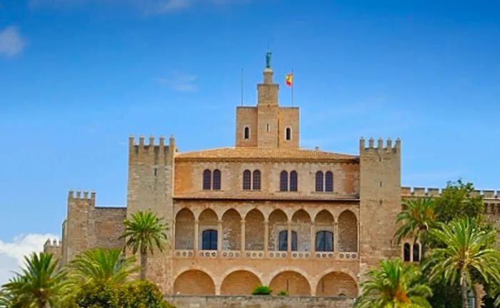 a full view of the Royal Palace of La Almudaina in Palma de Mallorca