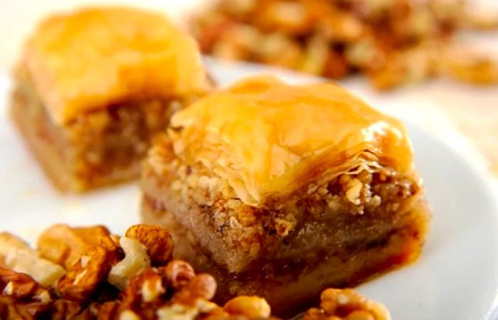 small pieces of baklava served on a white plate