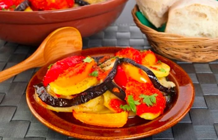 a plate of tumbet accompanied by some bread on the side