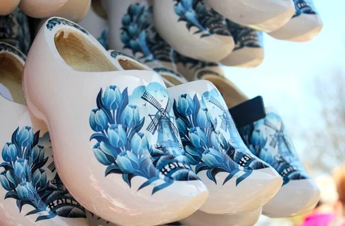 Ceramic Dutch shoes in blue and white featuring windmill designs