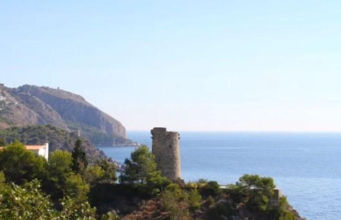 A stunning cliffside view of the Maro-Cerro Gordo Cliffs