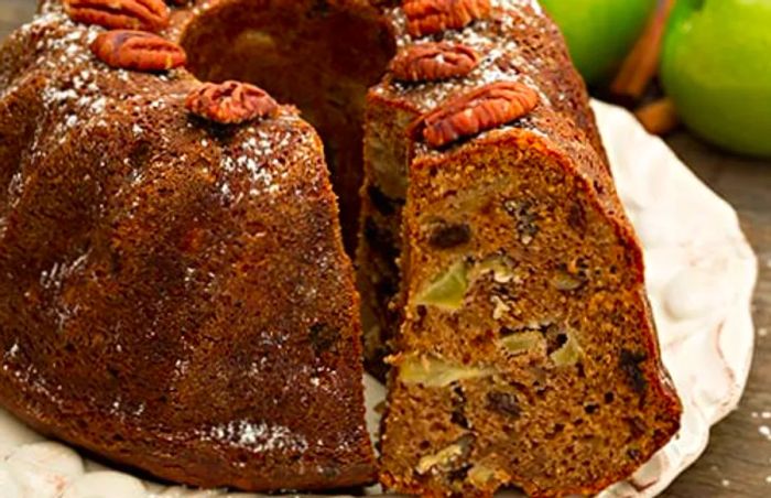 a plate of fresh rum cake from Princess Cays, featuring raisins and nuts