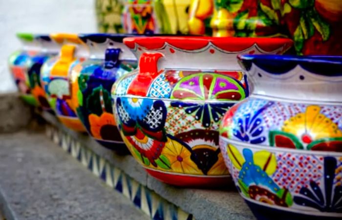 six vibrant talavera ceramics from Mexico displayed in a row