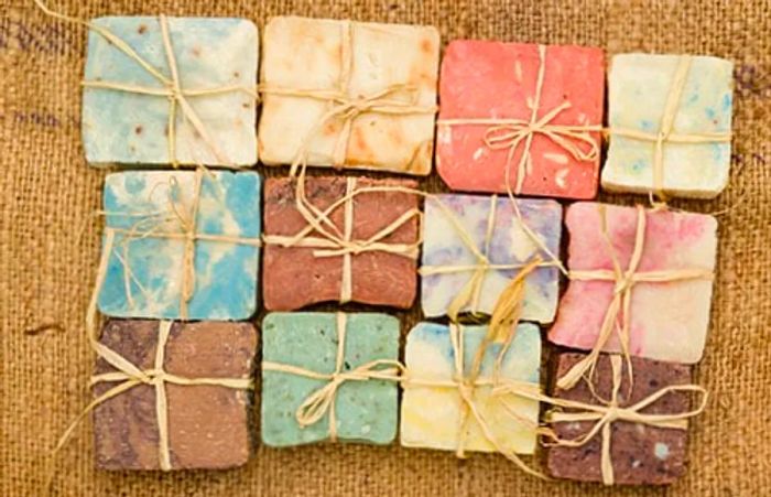 a selection of natural bath soaps from Princess Cays, showcasing an array of colors and scents