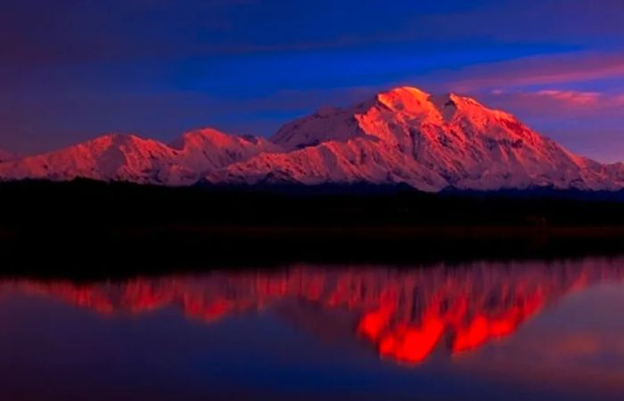 Snow-covered mountains in Alaska at sunset