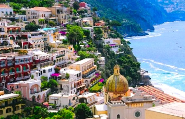 an aerial view of Positano and its beautiful beach