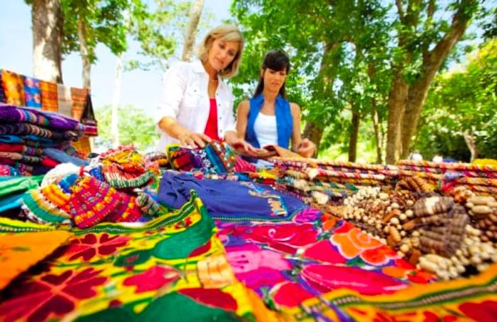 Two women exploring local fabric shops in St. Lucia