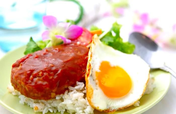 A plate of loco moco accompanied by rice