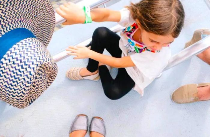 daughter seated on the boat floor