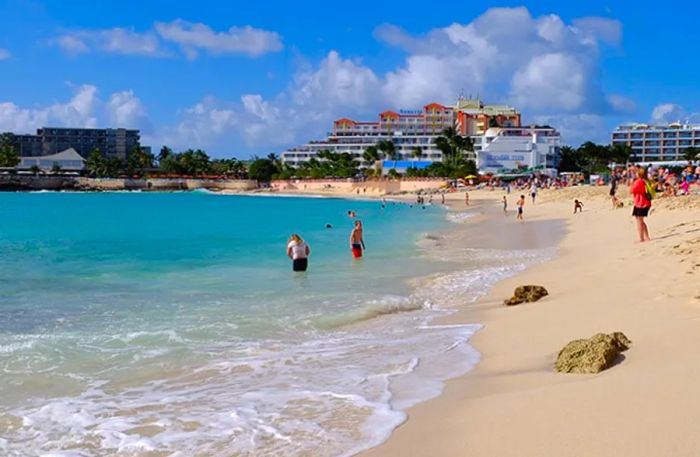 Beachgoers enjoying the sun and water