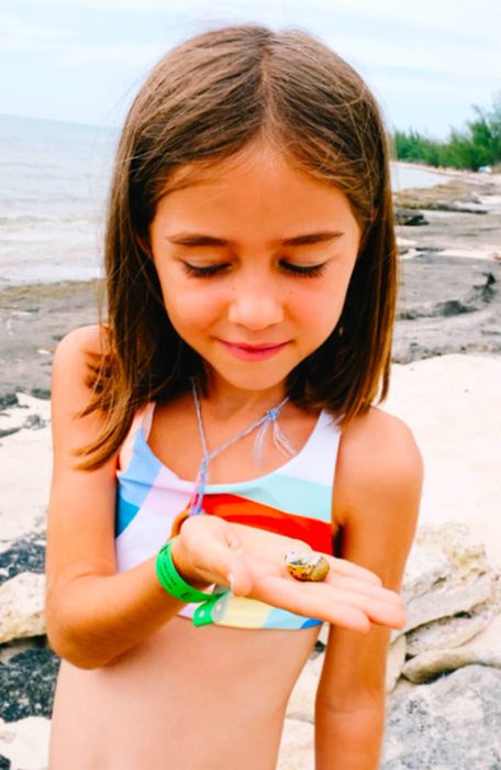 daughter clutching a small shell