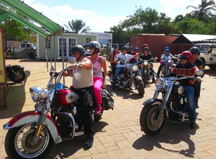 groups of people touring Bonaire on Harley Davidson motorcycles