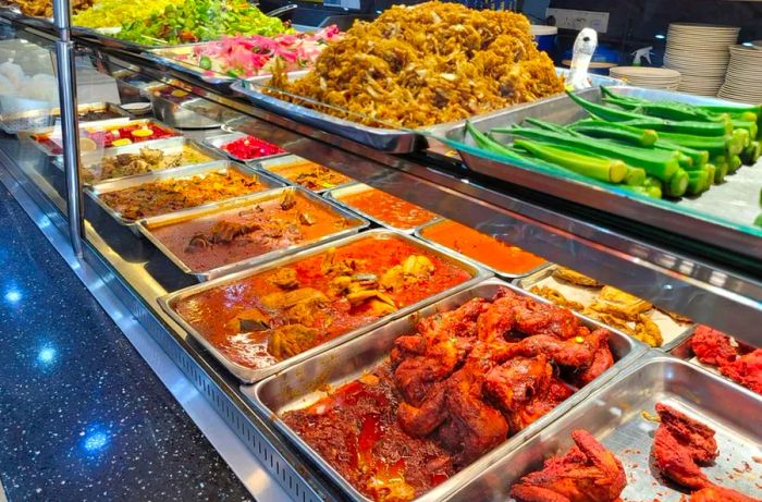 A selection of spicy curry dishes commonly referred to as 'Nasi Kandar' on display